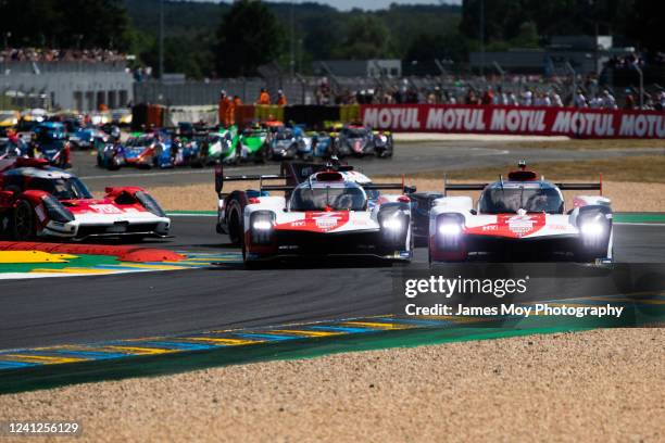 The Toyota Gazoo Racing GR010 Hybrid of Sebastien Buemi, Brendon Hartley, and Ryo Hirakawa and the Toyota Gazoo Racing Toyota GR010 Hybrid of Mike...