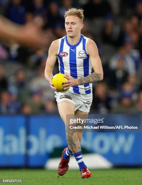 Jaidyn Stephenson of the Kangaroos in action during the 2022 AFL Round 13 match between the North Melbourne Kangaroos and the GWS Giants at Marvel...