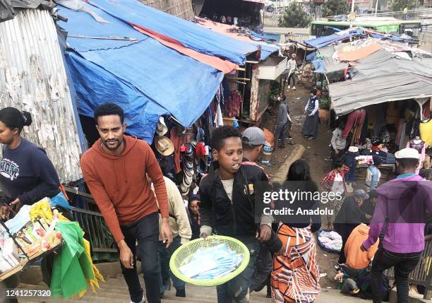 Children are seen engaged in shoe shining and selling traditional Ethiopian bread injera, and gums, in the Ethiopian capital of Addis Ababa on June...