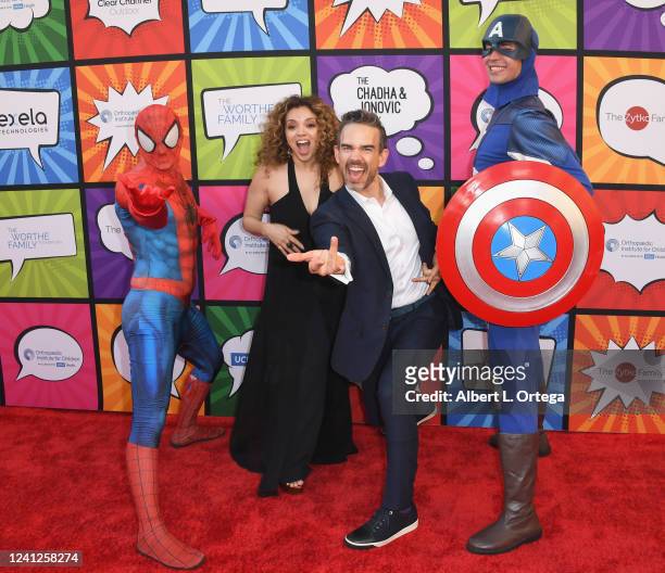 Anel Lopez Gorham and Christopher Gorham with Spider-Man and Captain America attend Orthopedic Institute For Children Presents Stand For Kids Annual...