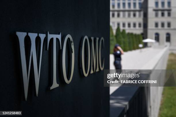 Security guard waits at the entrance of the World Trade Organization headquarters on the start of a four-day WTO Ministerial Conference in Geneva on...