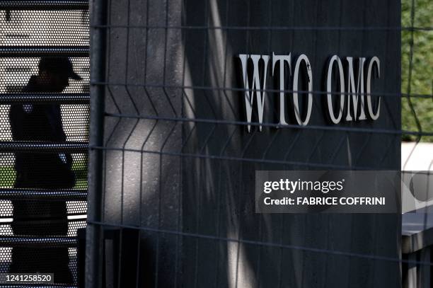 Security guard waits at the entrance of the World Trade Organization headquarters on the start of a four-day WTO Ministerial Conference in Geneva on...