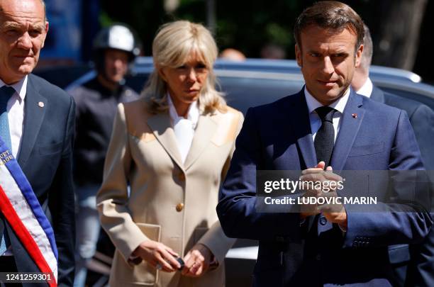 France's President Emmanuel Macron , his wife French first lady Brigitte Macron and Touquet's mayor Daniel Fasquelle arrive to vote in French...