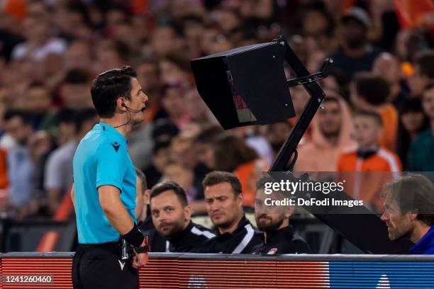 Halil Umut Meler looking at the VAR screen to see if he made the right decision during the UEFA Nations League League A Group 4 match between...