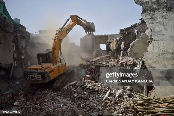 Bulldozer is being used to demolish the illegal structures of the residence of Javed Ahmed, a local leader who was allegedly involved in the recent...