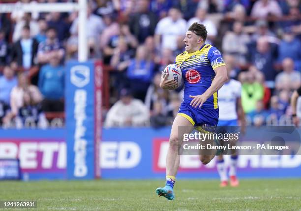 Warrington Wolves' Matty Ashton breaks free to go on and score their side's fourth try during the Betfred Super League match at the Be Well Support...