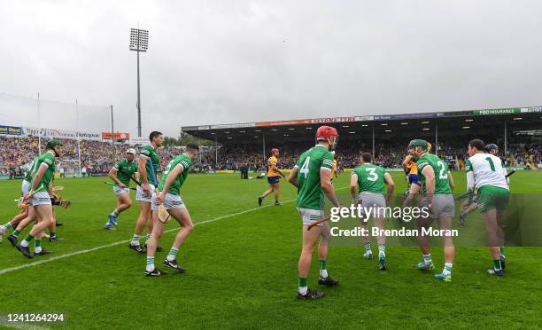 Tipperary , Ireland - 5 June 2022; Seán Finn of Limerick, second from right, encourages his teammates as they leave the parade before the Munster GAA...