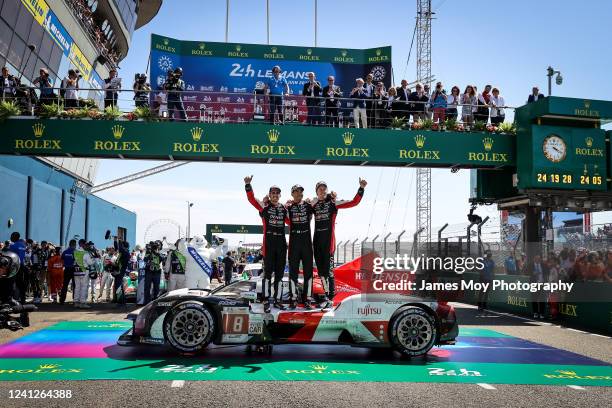 Race winners the Toyota Gazoo Racing GR010 Hybrid of Sebastien Buemi, Brendon Hartley, and Ryo Hirakawa celebrate at the end of the Le Mans 24 Hours...