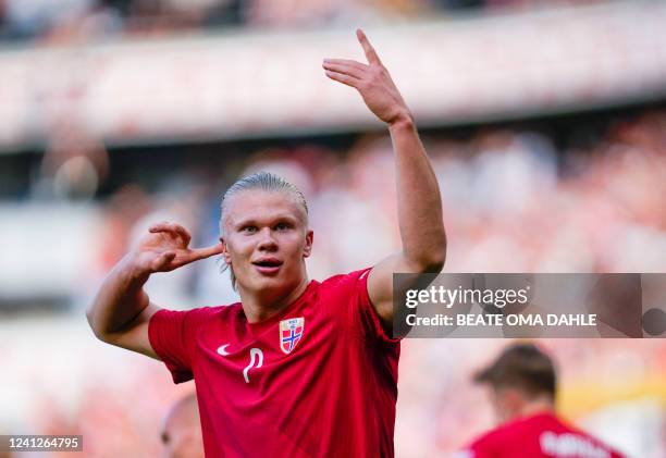 Norway's forward Erling Braut Haaland celebrates scoring the opening goal with his teammates during the UEFA Nations League football match Norway v...