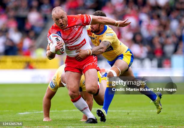 St Helens' James Roby is tackled by Hull Kingston Rovers' George King and Ben Crooks during the Betfred Super League match at the Totally Wicked...