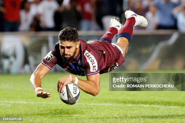 Bordeaux' French fullback Romain Buros scores a try during the French Top 14 playoff match between Bordeaux and Racing 92 at Stade Chaban-Delmas in...