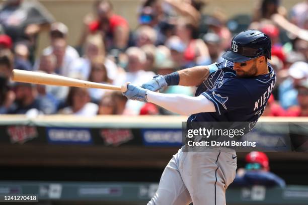 Kevin Kiermaier of the Tampa Bay Rays hits an RBI single against the Minnesota Twins in the fifth inning at Target Field on June 12, 2022 in...