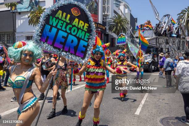 People march in the annual Pride Parade on June 12, 2022 in the Hollywood section of Los Angeles, California. After a two-year hiatus due to the...