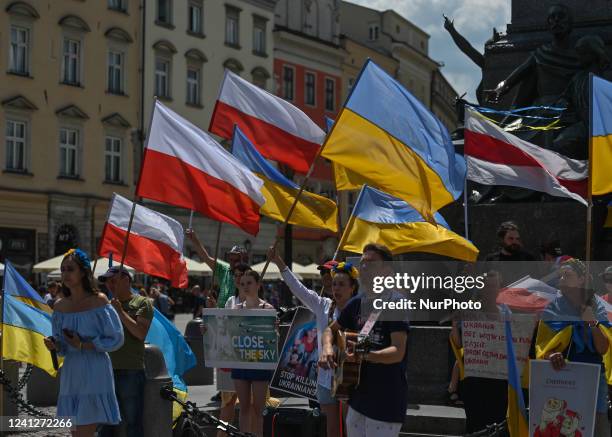 Members of the local Ukrainian diaspora, war refugees, peace activists, volunteers and local supporters during the 109th day of the 'Protest Nato...