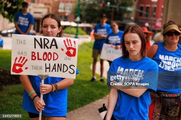 Protester holds a placard that says The NRA has blood on their hands, as gun control advocates participate in a 'March For Our Lives' rally and march...