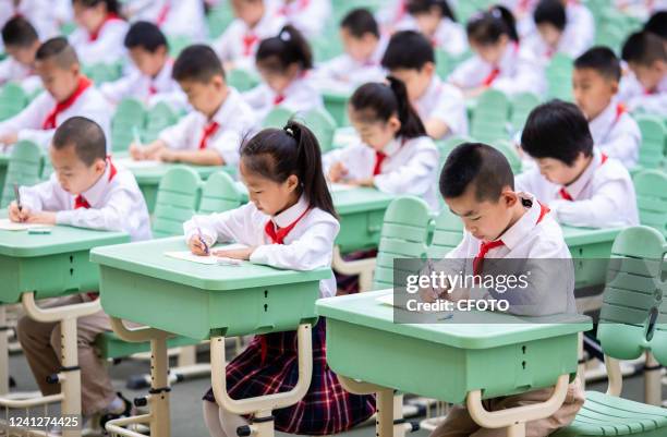 Students from Hengchang Dianxiang Primary School take part in a Chinese writing contest in Yuquan district of Hohhot, North China's Inner Mongolia...