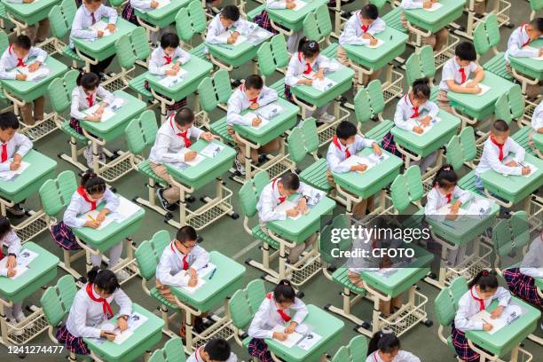Students from Hengchang Dianxiang Primary School take part in a Chinese writing contest in Yuquan district of Hohhot, North China's Inner Mongolia...