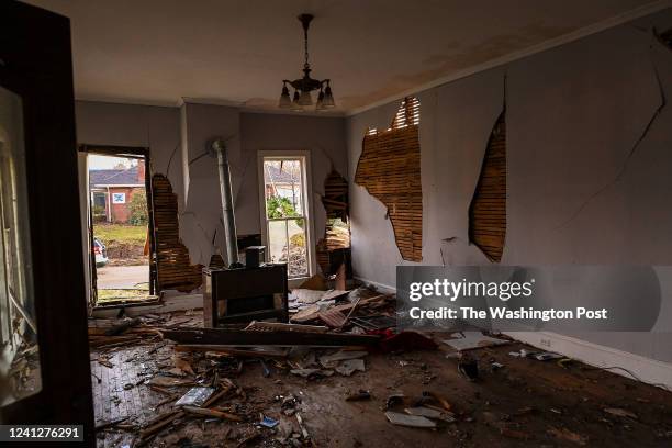 Debris rest in the living room of Cathy Gallimores tornado damaged home on December 13, 2021 in Dresden, Tennessee. Multiple storms ripped through...