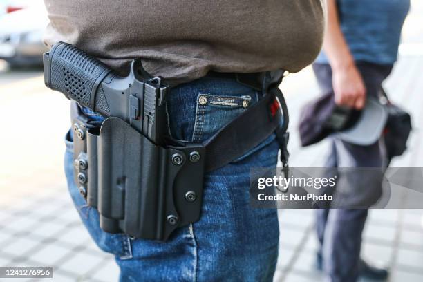 Handgun is seen in a holster in this illustration photo taken in Krakow, Poland on June 11, 2022.