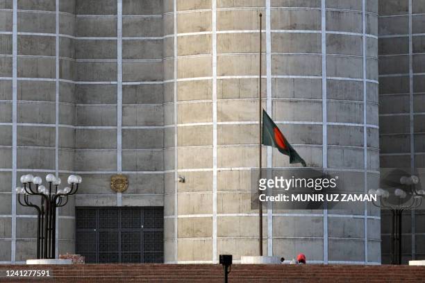 The Bangladeshi national flag is seen at half-mast in front of the Bangladesh National parliament building fly in Dhaka on February 28 as the...