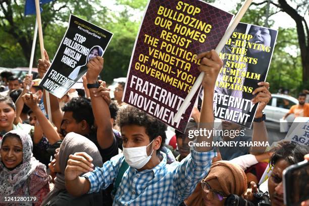 Students display placards and shout slogans during a demonstration outside the Uttar Pradesh Bhawan in New Delhi on June 13 to protest against the...