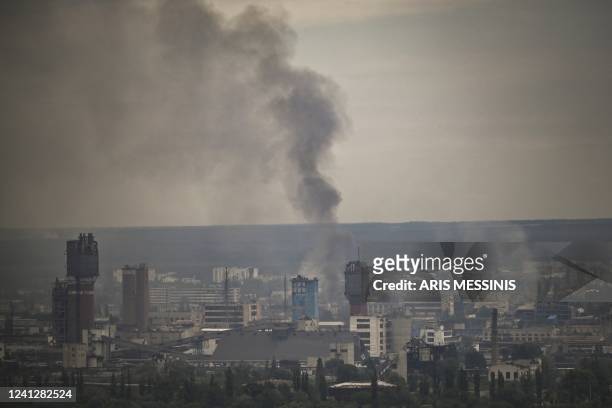 Smoke rises from the city of Severodonetsk in the eastern Ukrainian region of Donbas on June 13 amid Russian invasion of Ukraine. - The cities of...
