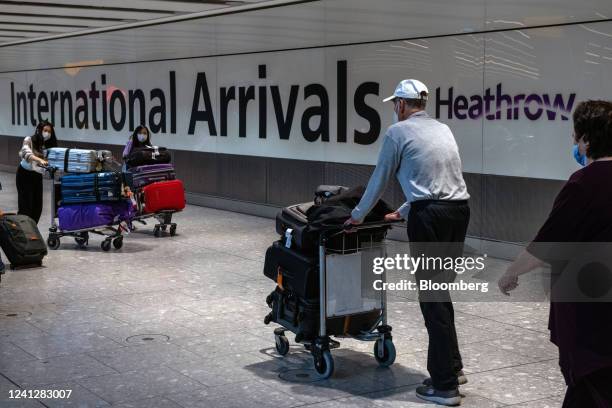 Passengers in the arrivals hall of Terminal 5 at London Heathrow Airport in London, UK, on Monday, June 13, 2022. Heathrow airport said its policy of...