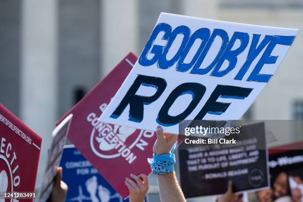 Pro-life activists protest outside of the U.S. Supreme Court as they wait for the court to hand down its decision to overturn Roe v. Wade on Monday...