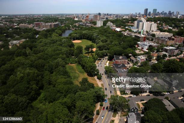 Seen from above, the Jamaicaway runs past Olmsted Park , Leverett Pond in Boston on June 7, 2022. Jamaica Plain is at right, and downtown Boston can...