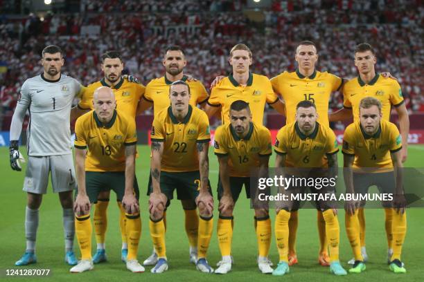 Australia's players pose for a group picture ahead of the FIFA World Cup 2022 inter-confederation play-offs match between Australia and Peru on June...