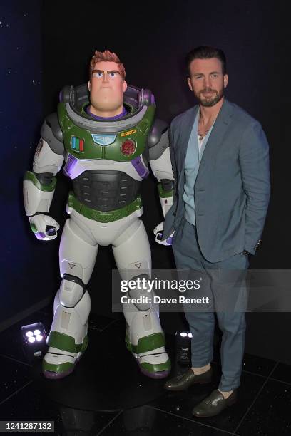 Chris Evans poses with Buzz Lightyear at the UK Premiere of "Lightyear" at Cineworld Leicester Square on June 13, 2022 in London, England.