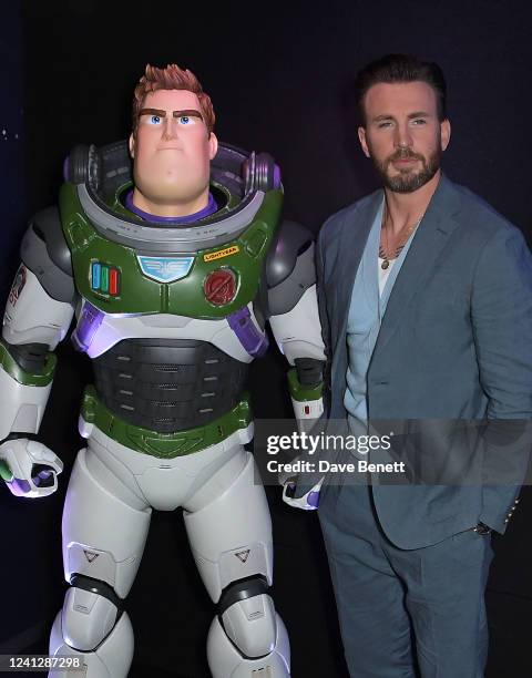 Chris Evans poses with Buzz Lightyear at the UK Premiere of "Lightyear" at Cineworld Leicester Square on June 13, 2022 in London, England.