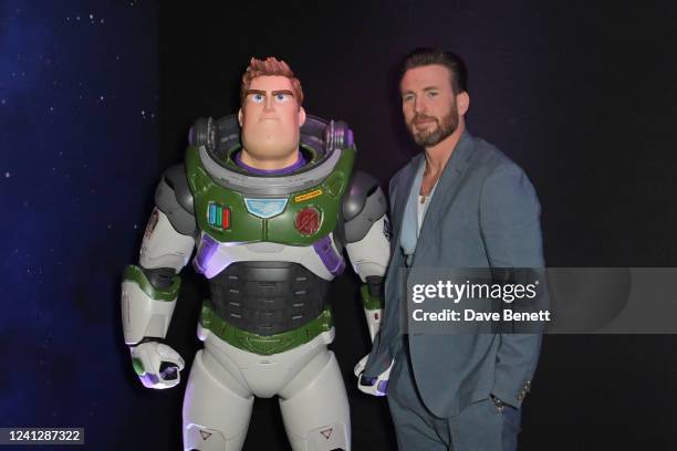 Chris Evans poses with Buzz Lightyear at the UK Premiere of "Lightyear" at Cineworld Leicester Square on June 13, 2022 in London, England.