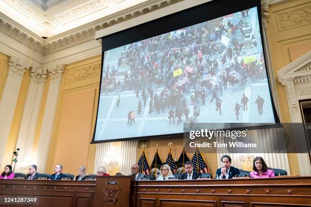 Footage of rioters are pictured during the Select Committee to Investigate the January 6th Attack on the United States Capitol second hearing to...