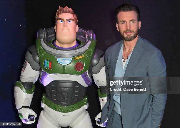 Chris Evans poses with Buzz Lightyear at the UK Premiere of "Lightyear" at Cineworld Leicester Square on June 13, 2022 in London, England.