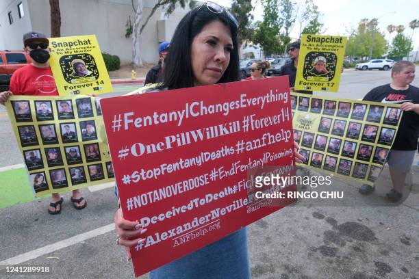 People opposed to the sale of illegal drugs on Snapchat participate in a rally outside the company's headquarters to call for tighter restrictions on...