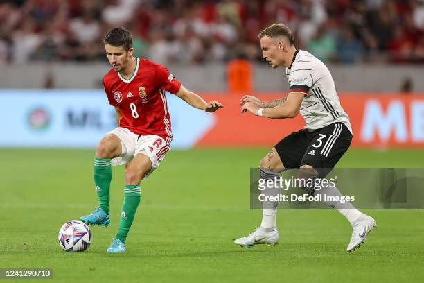 Adam Nagy of Hungary and David Raum of Germany battle for the ball during the UEFA Nations League League A Group 3 match between Hungary and Germany...