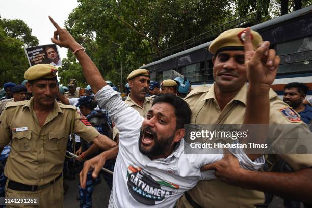 Police and security personnel and Congress Party supporters during the Satyagrah March and protest over summoning of party leader Rahul Gandhi in the...