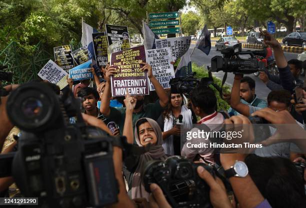Activists of Fraternity movement, Students Islamic Organisation of India and others hold placards and protest against the Bulldozer action and...
