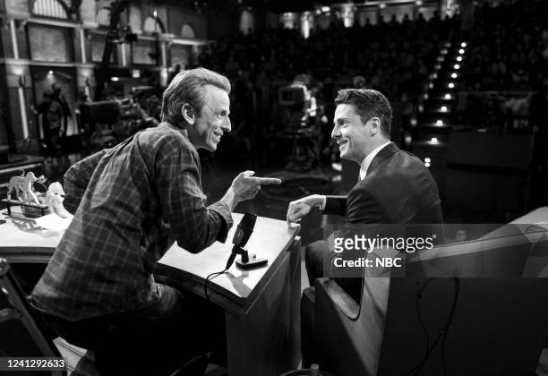 Episode 1305 -- Pictured: Host Seth Meyers talks with actor Matthew Goode during an commercial break on June 13, 2022 --