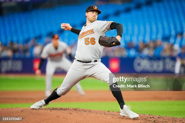 Kyle Bradish of the Baltimore Orioles pitches to the Toronto Blue Jays in the first inning during their MLB game at the Rogers Centre on June 13,...