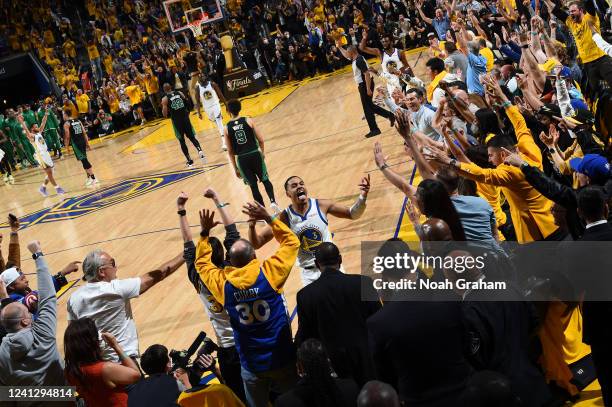 Jordan Poole of the Golden State Warriors celebrates after making a three point basket buzzer beater in the third quarter during Game Five of the...