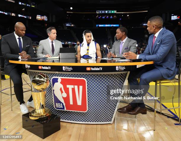 Analysts, Brendan Haywood, Matt Winer, Isiah Thomas, and Grant Hill talk to Jordan Poole of the Golden State Warriors after Game Five of the 2022 NBA...