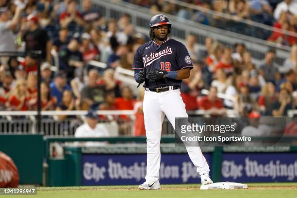 Washington Nationals first baseman Josh Bell hits a triple in the fifth inning during a regular season game between the Milwaukee Brewers and...