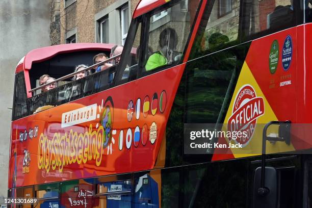 Tourists on a sightseeing bus on the Royal Mile, on June 14 in South Queensferry, Scotland.