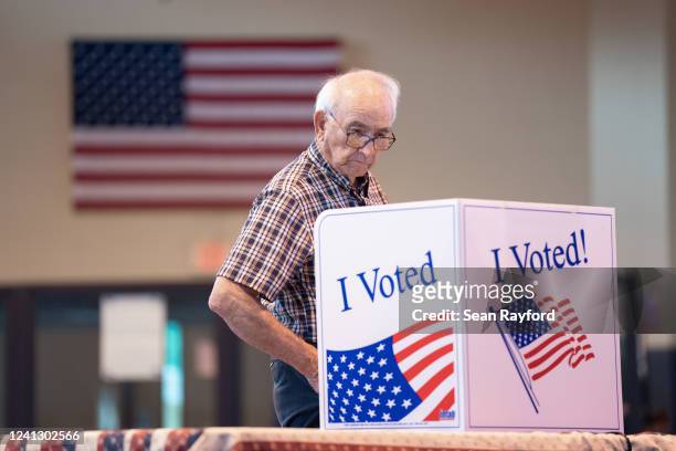 Man casts a vote for midterm primary elections on June 14, 2022 in West Columbia, South Carolina. Maine, Nevada and North Dakota also held midterm...