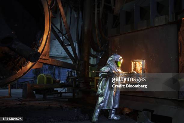 Worker takes a sample of molten nickel matte from a top blown rotary converter the Vale Copper Cliff Nickel Smelter in Sudbury, Ontario, Canada, on...
