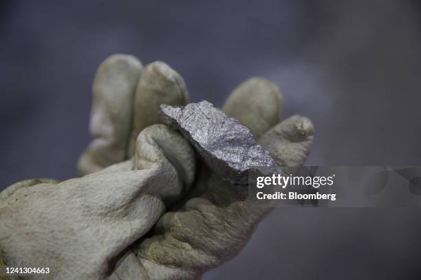 Worker holds a chunk of Bessemer matte at the Vale Copper Cliff Smelter Complex in Sudbury, Ontario, Canada, on Wednesday, June 1, 2022. Nickel is...