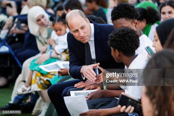 Prince William, Duke of Cambridge speaks with attendees during a memorial service to mark the fifth anniversary of the Grenfell Tower fire on June...