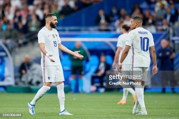 Karim Benzema of France and Kylian Mbappe of France talk during the UEFA Nations League League A Group 1 match between France and Croatia at Stade de...